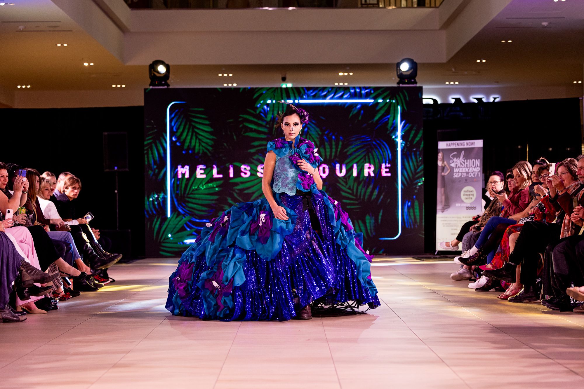 Model in a blue gown on the runway at Saskatchewan Fashion Week