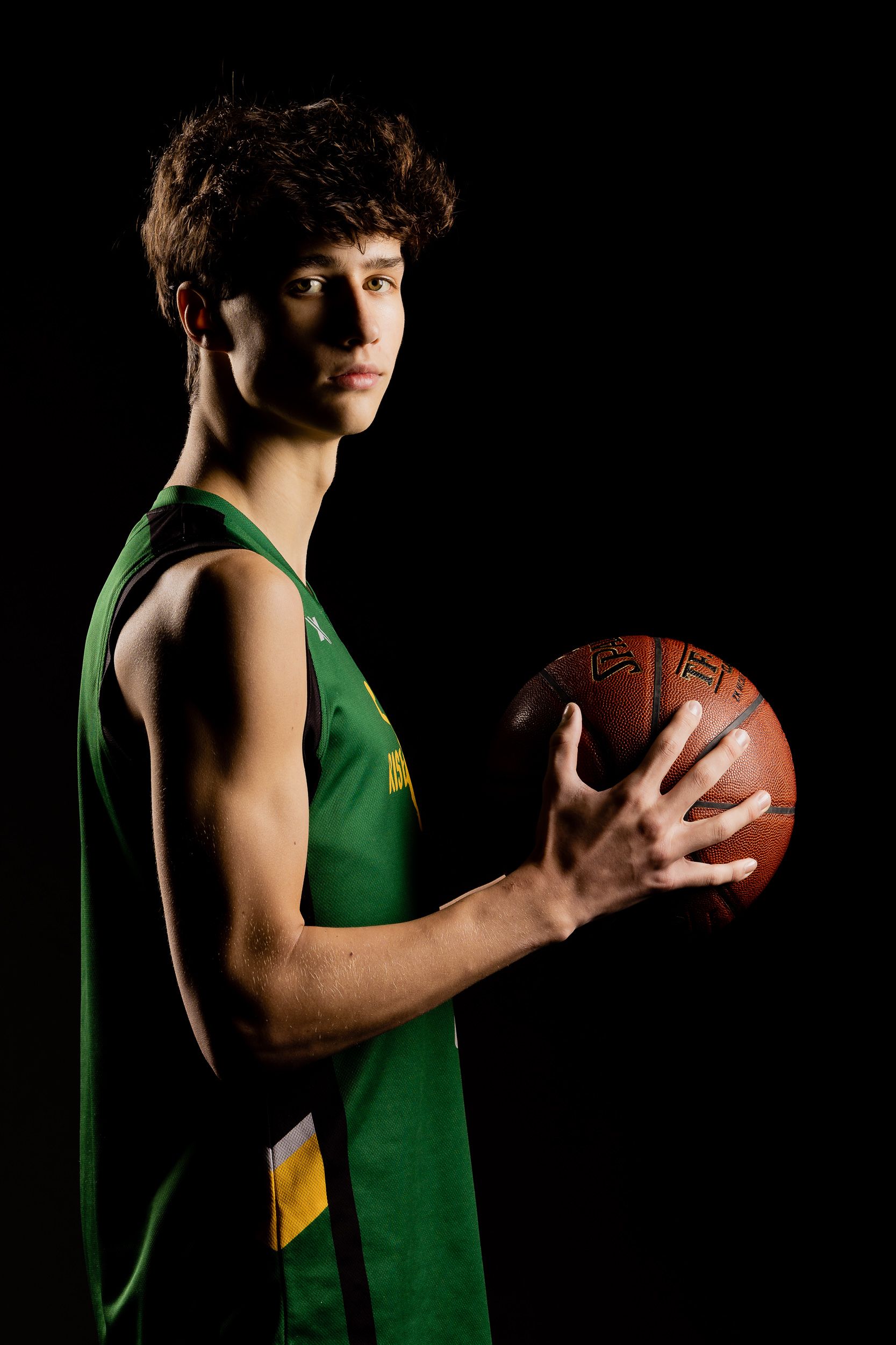 Basketball player portrait with dramatic studio lighting