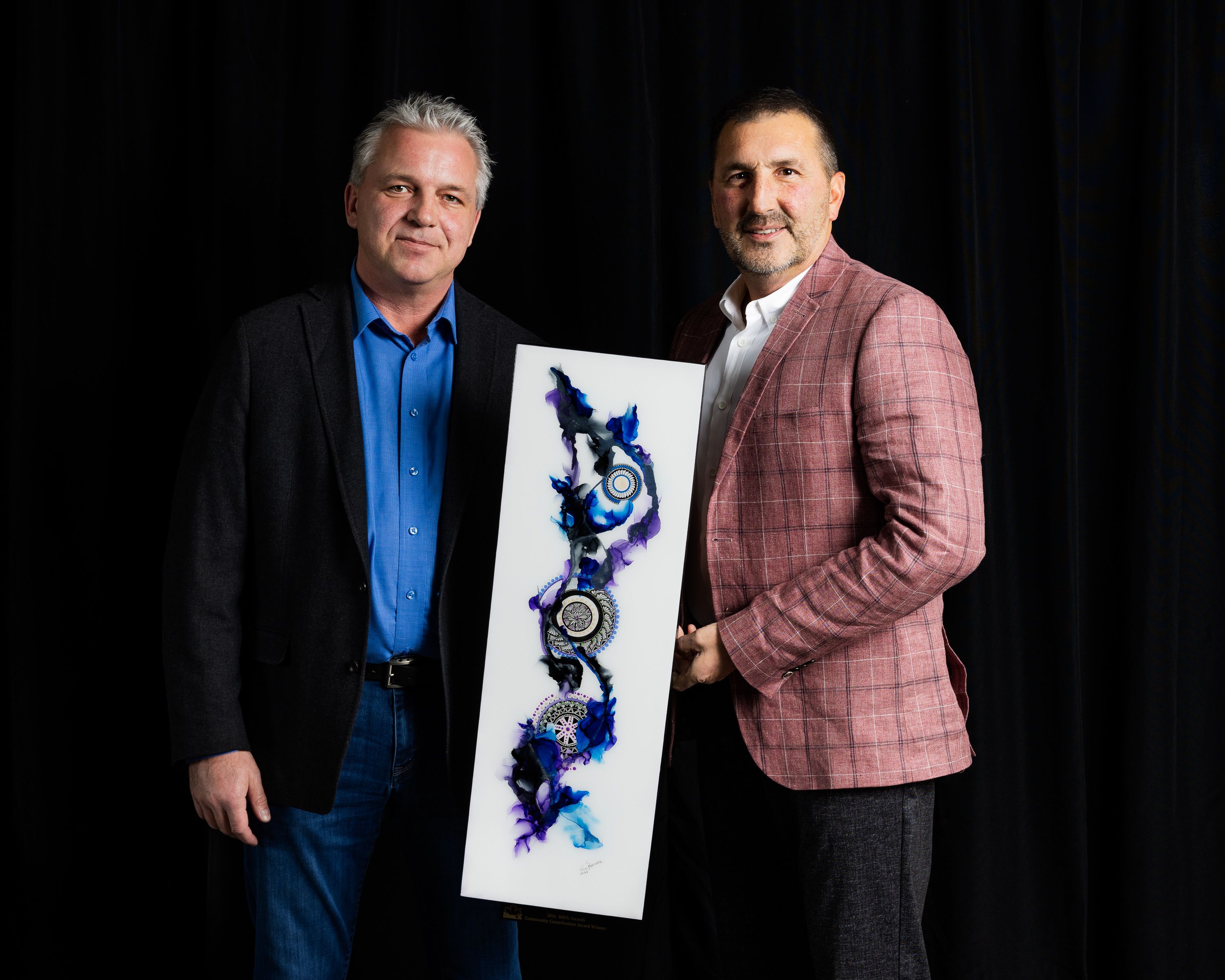 Award winners with their artwork at the Battlefords business excellence awards