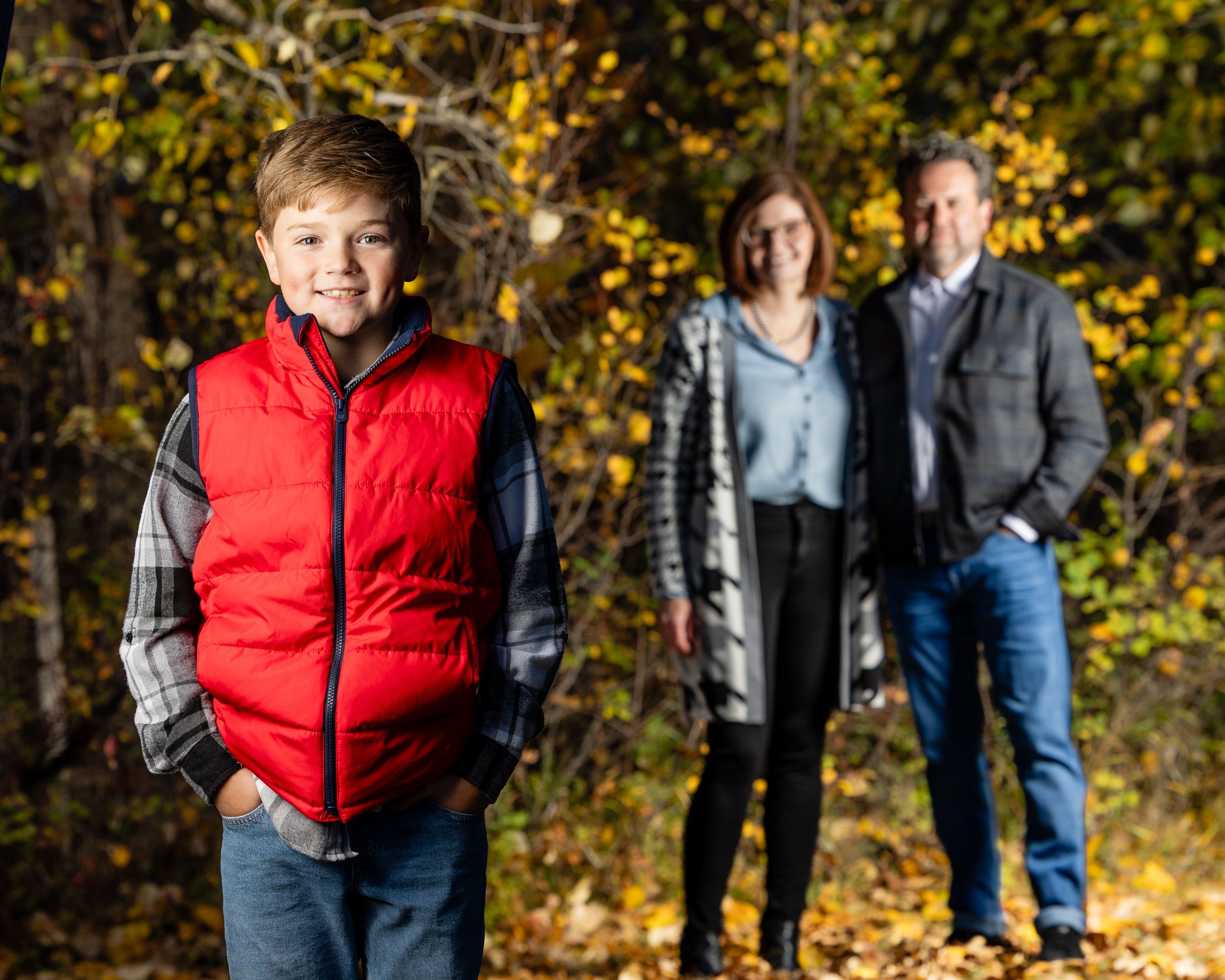 Family portrait in a prairie field at sunset