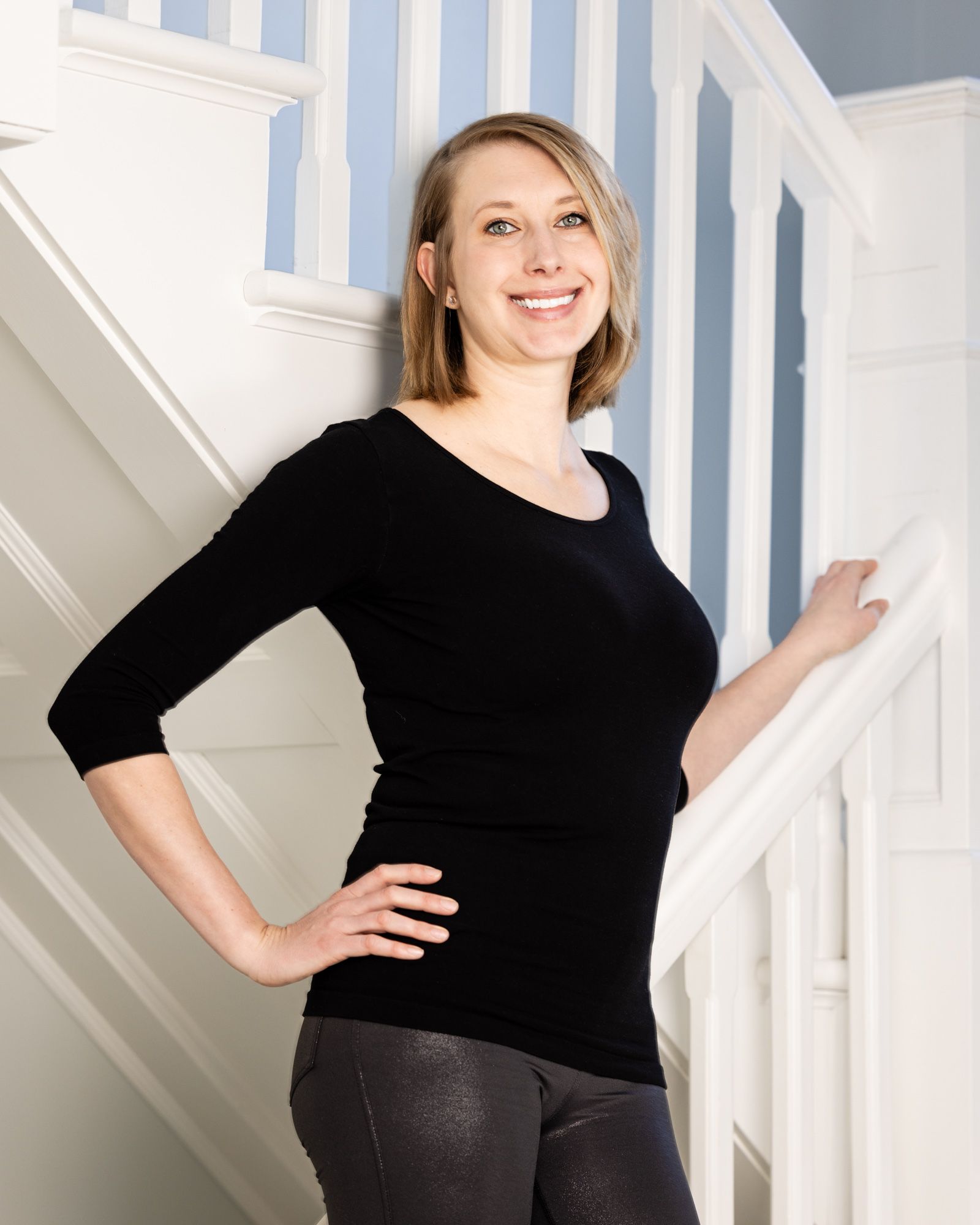 Lifestyle business portrait on a bright staircase