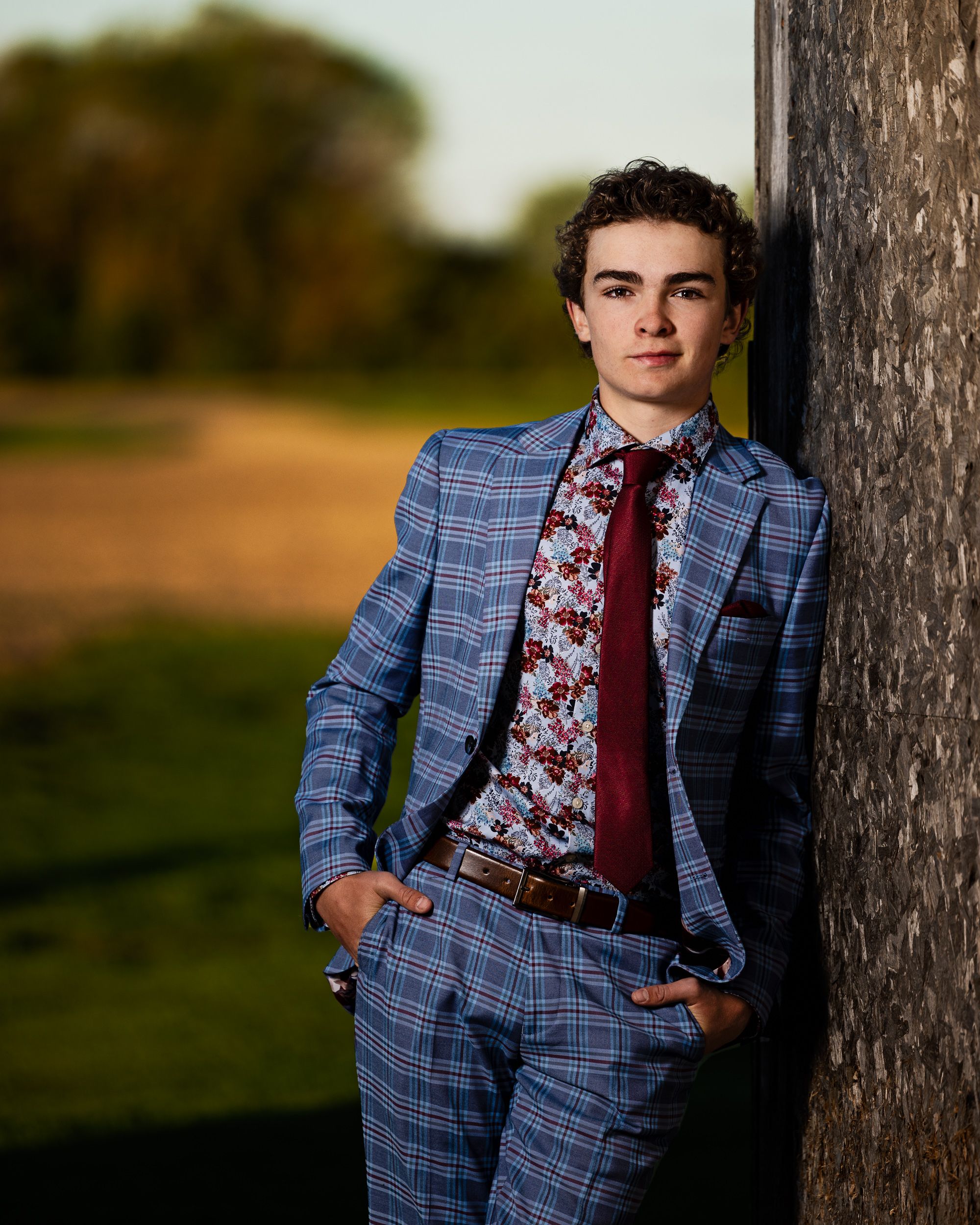 Young man photographed outdoors at dusk